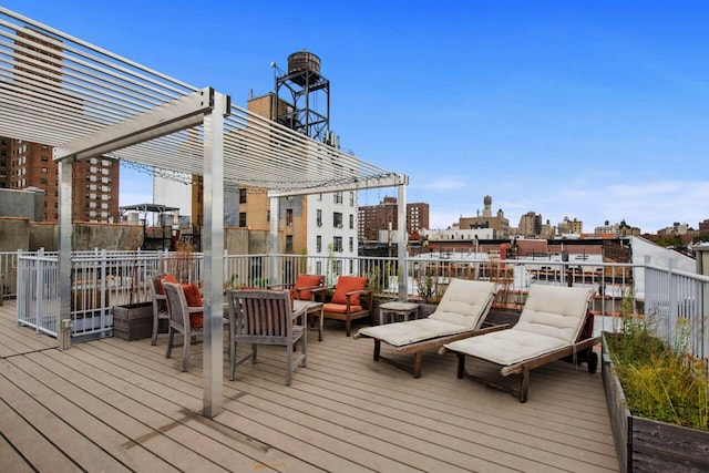 wooden deck featuring a view of city, outdoor lounge area, and a pergola