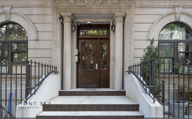 property entrance featuring fence