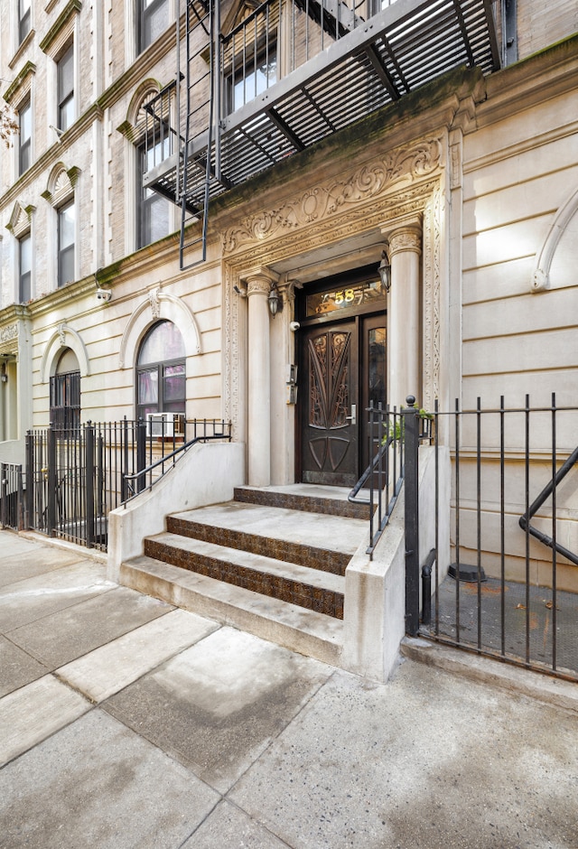 property entrance featuring fence