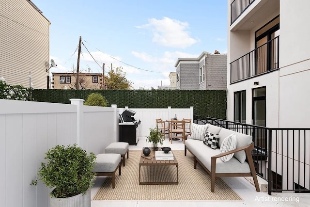 view of patio with area for grilling and outdoor lounge area