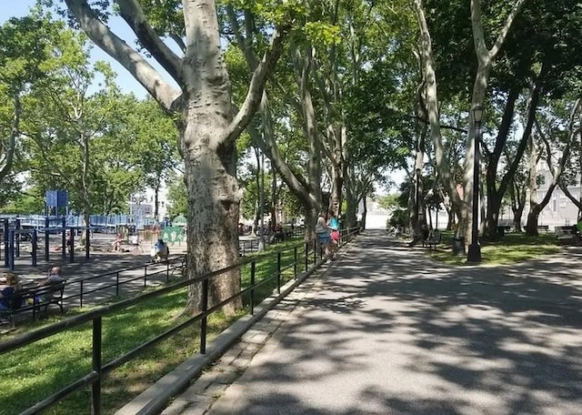 view of property's community featuring fence