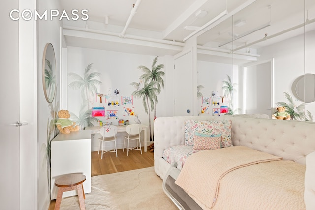 bedroom featuring wood finished floors