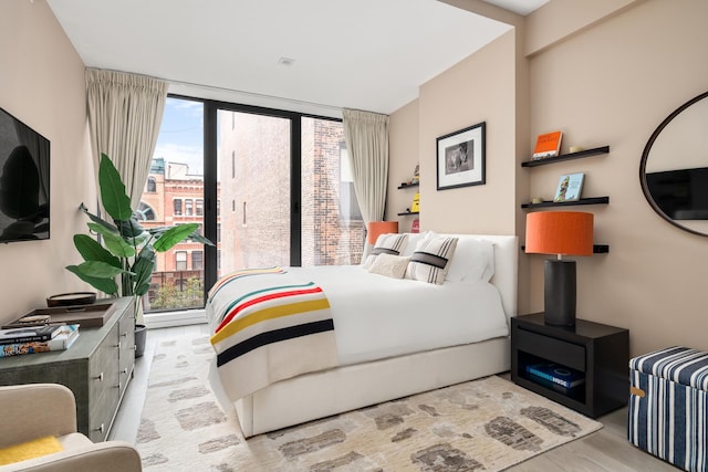 bedroom featuring a wall of windows