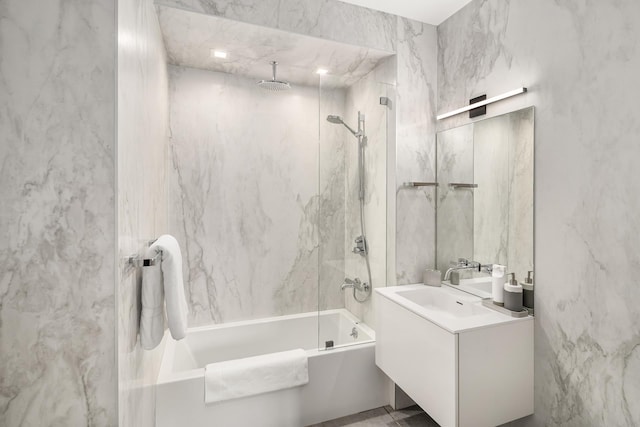 full bathroom featuring a combined bath / shower with rainfall shower and vanity