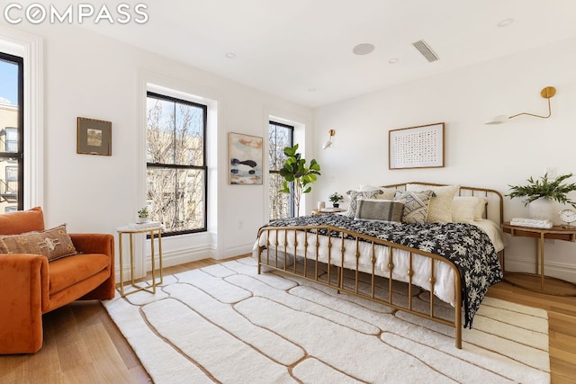 bedroom with light hardwood / wood-style floors