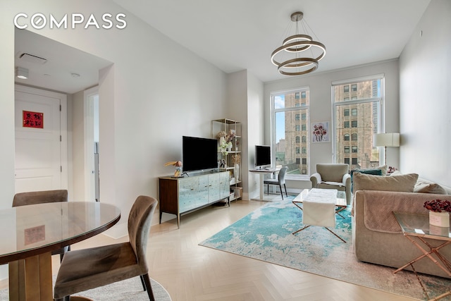 living area featuring a chandelier