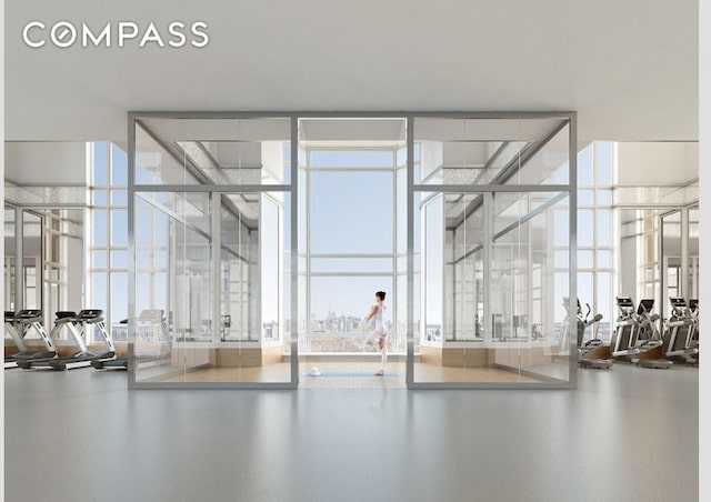 workout area with floor to ceiling windows and a wealth of natural light