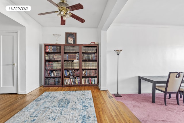 sitting room featuring baseboards, visible vents, ceiling fan, and wood finished floors