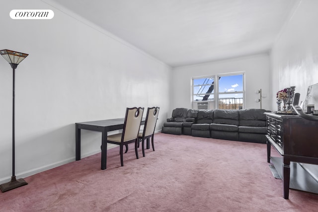 carpeted living area with visible vents, baseboards, and ornamental molding