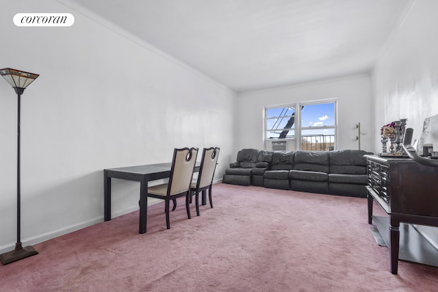 carpeted living area with visible vents, ornamental molding, and baseboards