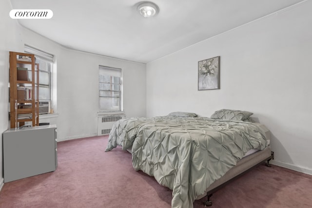 carpeted bedroom featuring cooling unit and radiator heating unit