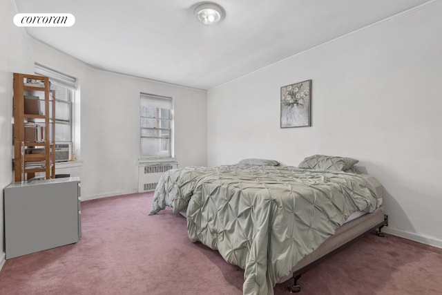 bedroom with carpet flooring, radiator heating unit, baseboards, and visible vents