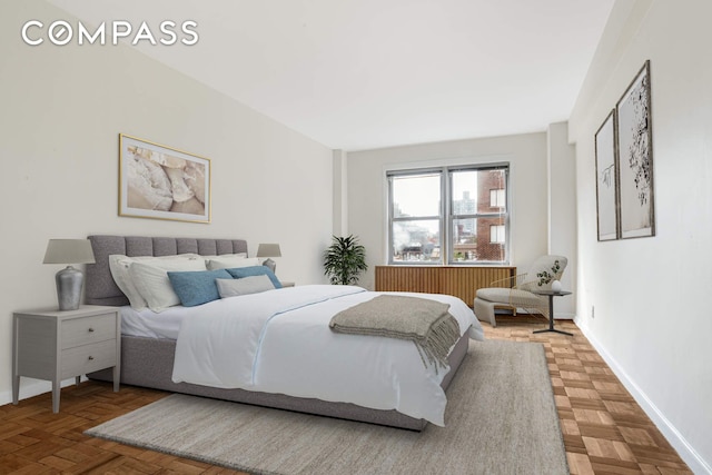 515 E 85th St Unit 8C, New York City, NY 10028 - bedroom featuring baseboards