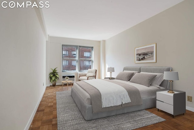 bedroom with dark parquet flooring