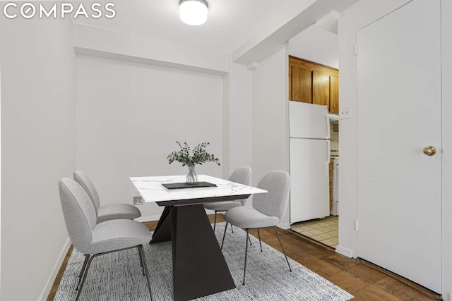 dining area with hardwood / wood-style floors