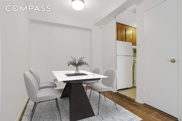 515 E 85th St Unit 8C, New York City, NY 10028 - dining room with wood finished floors and baseboards