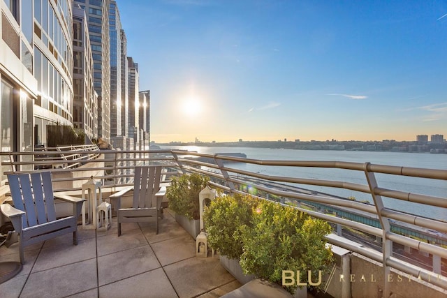 balcony at dusk with a water view