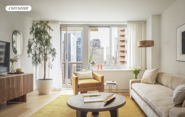 sitting room featuring light hardwood / wood-style flooring