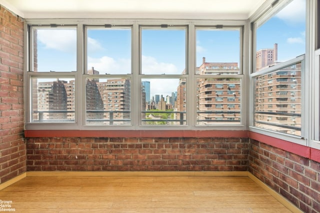 unfurnished sunroom with a wealth of natural light