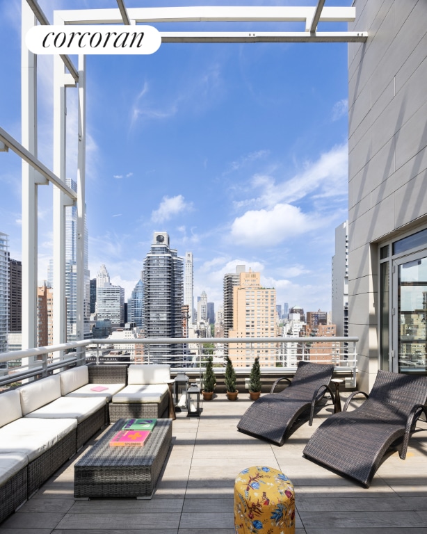 view of patio with a balcony and an outdoor hangout area