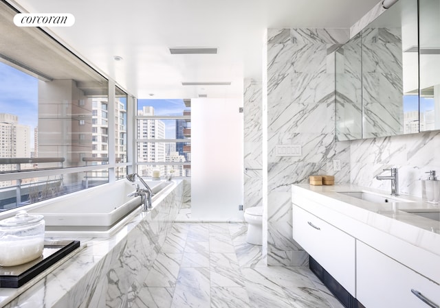 bathroom with visible vents, marble finish floor, vanity, and a city view