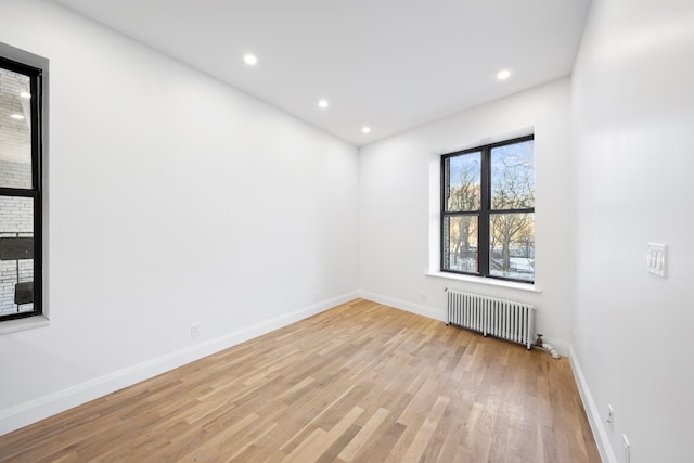 244 Riverside Dr Unit 2G, New York City, NY 10025 - spare room featuring radiator heating unit, light wood-type flooring, baseboards, and recessed lighting