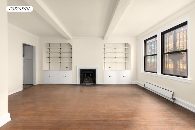 unfurnished living room featuring dark hardwood / wood-style floors, beam ceiling, built in features, and a baseboard heating unit