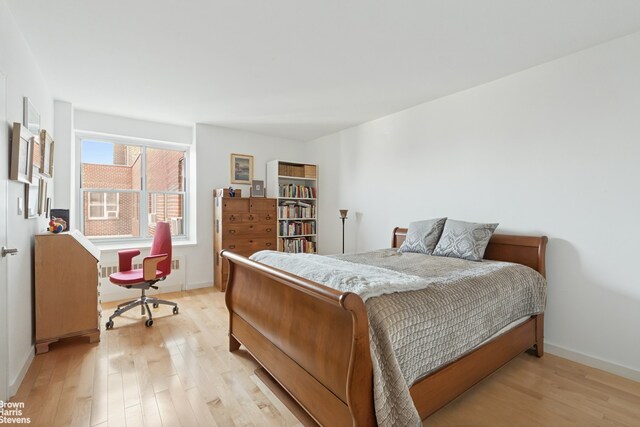 bedroom with light hardwood / wood-style floors