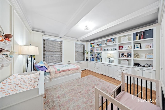 bedroom with beam ceiling and light hardwood / wood-style flooring