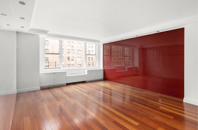 bedroom with dark hardwood / wood-style floors