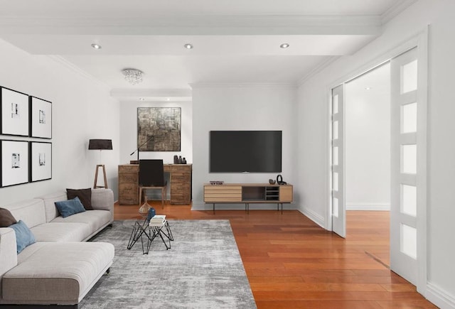 living room with ornamental molding and hardwood / wood-style floors