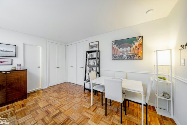 dining room with light parquet floors