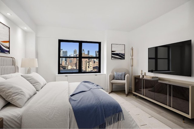 bedroom with light hardwood / wood-style flooring