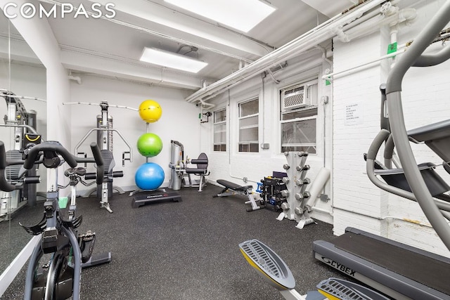 workout area featuring a wall mounted AC