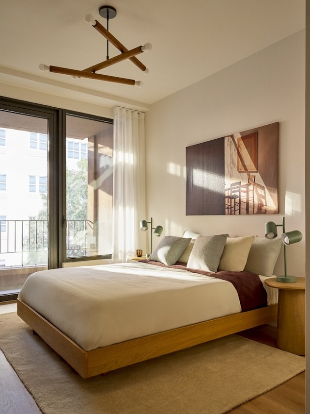 323 Bergen St Unit 119E, New York City, NY 11217 - bedroom with wood finished floors, access to outside, and a ceiling fan