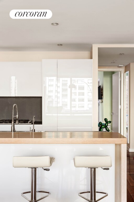 kitchen featuring wood-type flooring and a breakfast bar