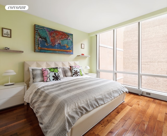 bedroom with hardwood / wood-style flooring