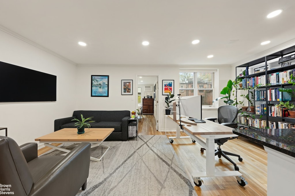 office area with crown molding, wood finished floors, and recessed lighting