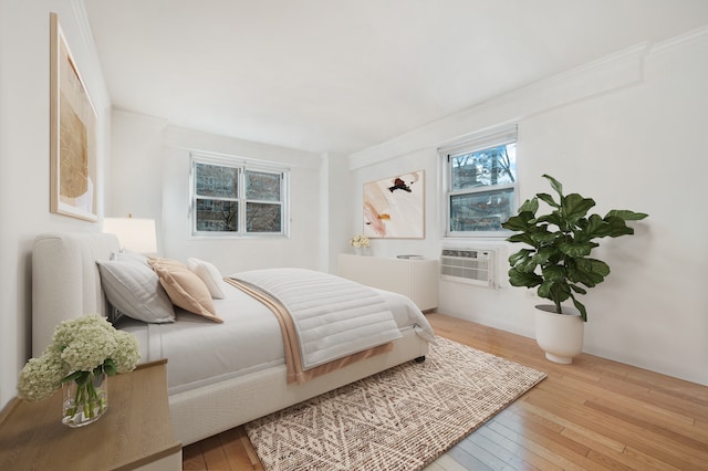 122 Ashland Pl Unit 3D, New York City, NY 11201 - bedroom with hardwood / wood-style flooring, ornamental molding, and cooling unit