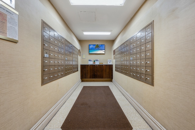 122 Ashland Pl Unit 3D, New York City, NY 11201 - hallway with mail area, baseboards, and speckled floor