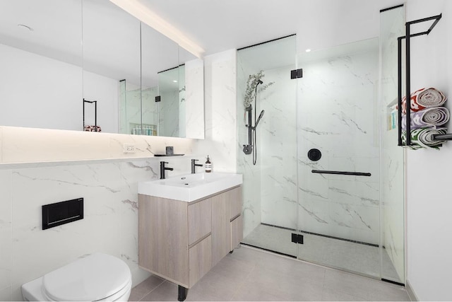 bathroom featuring a shower with door, vanity, and toilet