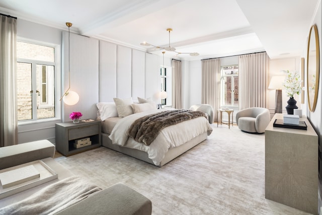 carpeted bedroom featuring ceiling fan, ornamental molding, and multiple windows