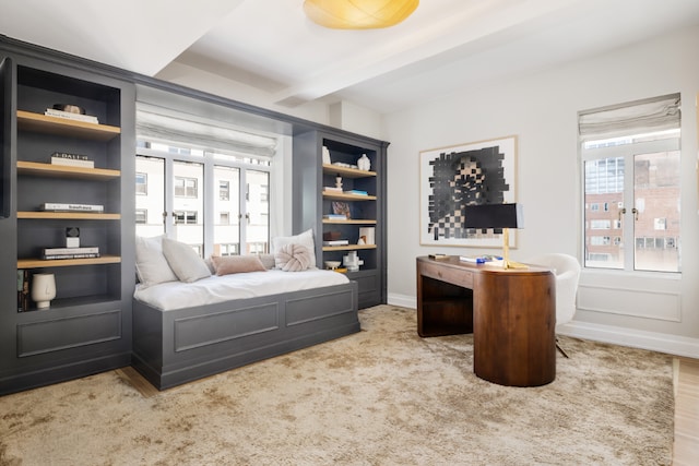 bedroom featuring light carpet