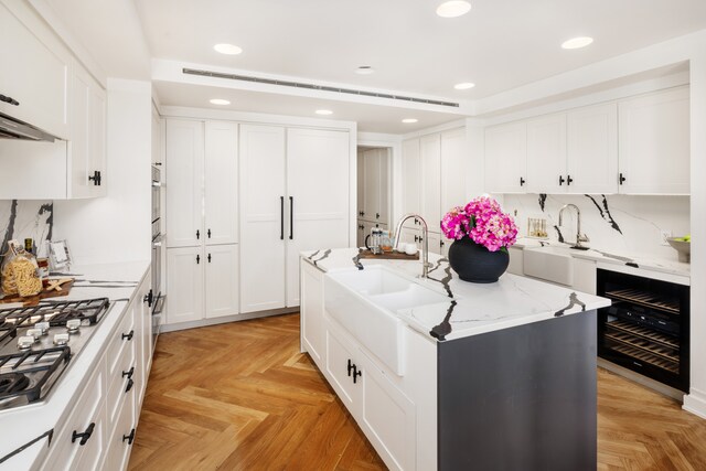 dining space featuring beamed ceiling and light wood-type flooring