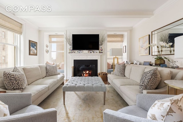 living room with crown molding, light hardwood / wood-style flooring, and beamed ceiling