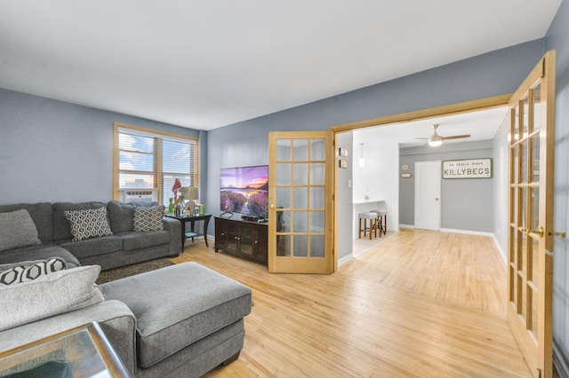 living room featuring hardwood / wood-style flooring and french doors