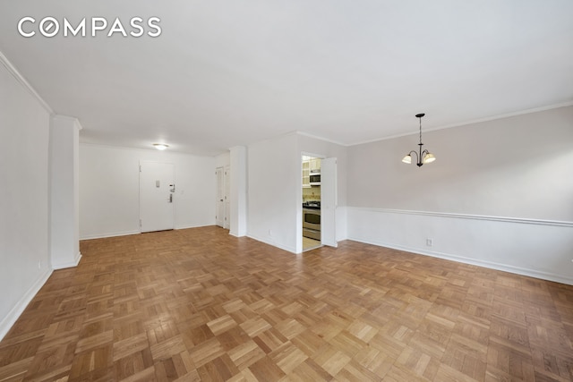 345 E 52nd St Unit 8G, New York City, NY 10022 - unfurnished living room with a chandelier and ornamental molding