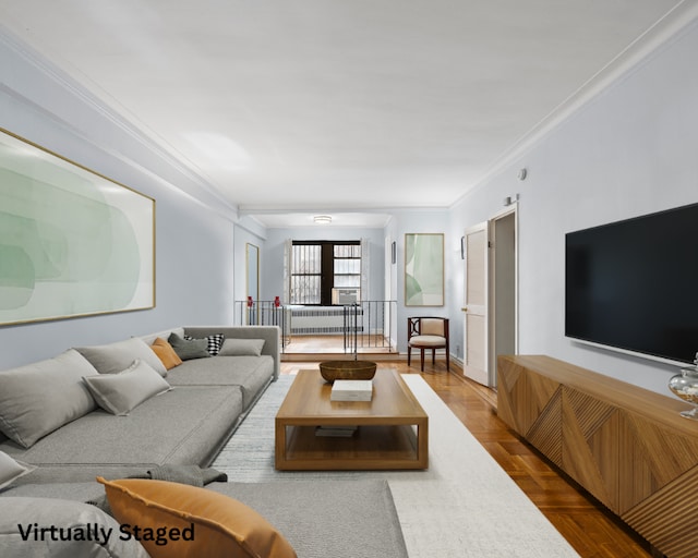 living room with parquet flooring and ornamental molding