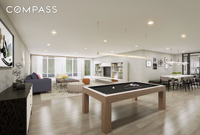 recreation room with recessed lighting, expansive windows, and hardwood / wood-style flooring