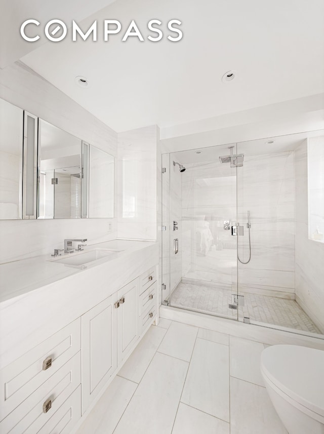 full bath featuring vanity, a shower stall, and recessed lighting